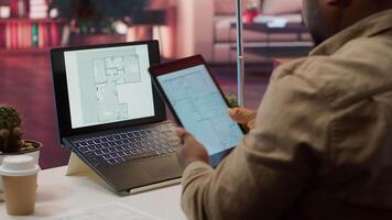 Corporate owner drafting architectural sketches for a new office, looking to relocate startup headquarters. Collaborating with contractors to design a functional and creative workspace. Camera A. video