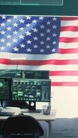 Vertical Empty governmental surveillance room shows an American flag, cybersecurity and data protection. High tech operations center focusing on threat and malware detection, security protocols. Camera B. video