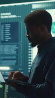 Vertical Cyber security team investigates governmental hacking malware attack on internet servers, high tech office. Cybercriminals hack computer systems, threatening account database protection. Camera A. video
