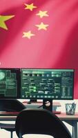 Vertical Empty governmental hacking room with chinese flag on a big screen, cyberwarfare and misinformation. Chinese propaganda, fake news and the spread of disinformation during a hybrid war. Camera A. video