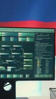 Vertical Surveillance and hacking room with a Russian flag on big screen, representing cyber espionage and digital manipulation. Russian government works on propaganda and misinformation campaigns. Camera A. video