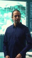 Vertical Cybersecurity team investigating cybercrime and malware attacks. IT security experts analyzing threats and protecting national security, working on data protection and privacy. Cyberwarfare. Camera A. video