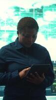 Vertical Governmental agency cyber defense team analyzing cyber attacks. IT security professionals working to prevent data breaches and protect against cybercrime, securing digital information. Camera A. video