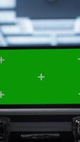 Vertical Green screen laptop used by engineers monitoring server room, doing checkup. Focus on chroma key notebook used by IT support employee working in data center facility, camera A close up video