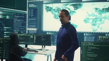 Cybersecurity team investigating cybercrime and malware attacks. IT security experts analyzing threats and protecting national security, working on data protection and privacy. Cyberwarfare. Camera B. video