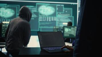Governmental hackers at work monitoring cyber threats in high tech agency, implementing cybersecurity measures. IT expert focuses the importance of online privacy and malware protection. Camera B. video