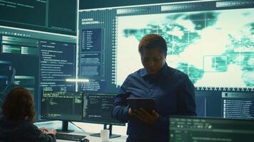 Governmental agency cyber defense team analyzing cyber attacks. IT security professionals working to prevent data breaches and protect against cybercrime, securing digital information. Camera B. video