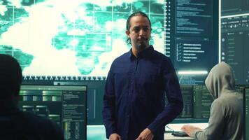 Cybersecurity team investigating cybercrime and malware attacks. IT security experts analyzing threats and protecting national security, working on data protection and privacy. Cyberwarfare. Camera A. video