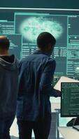 Vertical Cyber investigation team working in a governmental hacking room, working on computer security and phishing detection. Emphasizing online security, digital threats and malware prevention. Camera B. video