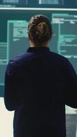 Vertical Governmental hackers at work planning advanced cyber attacks on servers infrastructure to gather intelligence, high tech spyware concept. Specialists hacking accounts for cyberwarfare. Camera B. video