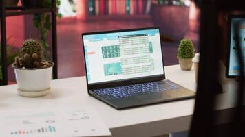 Empty office at a business entrepreneur house with laptop and documents showing financial reports for enterprise development. Remote work on bank account analytics, accountancy. video
