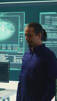 Vertical Hacking group targeting network security in governmental office, cyber attacks. Digital security specialists monitoring cyber operations and surveillance, preventing illegal activities. Camera B. video