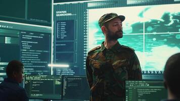 Armed forces cyber security team conducting top secret investigations, using advanced technology for secure communication and threat detection. Classified military information. Camera A. video