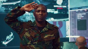 Military officer presenting the official custom salute etiquette, embodying discipline and respect. Federal army general saluting and greeting the crew captain in command center. Camera A. video