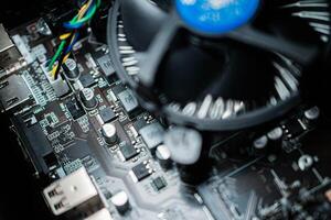 Close-up of Computer Motherboard with Cooling Fan photo
