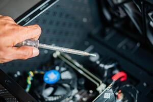 Applying thermal paste to computer CPU photo