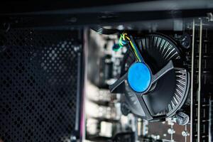 Close-up of computer CPU cooler and internal components photo