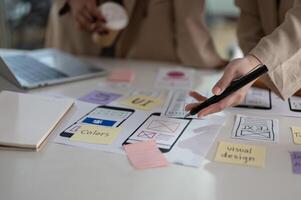 Close-up hand image of a creative UX UI graphic designer team is in the meeting. photo
