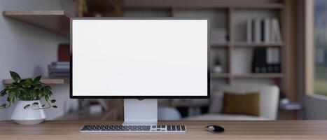 Front view image of a white-screen computer mockup on a wooden table in a modern living room. photo