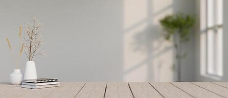 A space for displaying your product on a wooden plank table in a minimalist, white room. photo