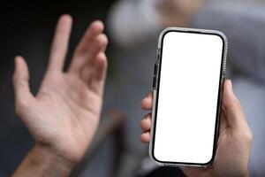 Close-up image of a dissatisfied man using his phone, unhappy with a lack mobile application. photo