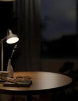A close-up image of a round wooden tabletop featuring objects in a dark room at night. photo