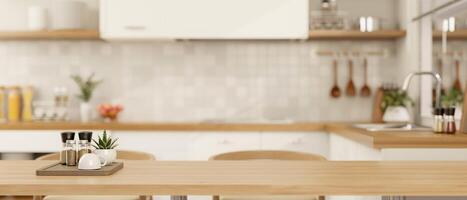 Copy space for displaying your product on a wooden dining table in a minimalist Scandinavian kitchen photo