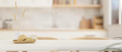 A copy space for displaying your product on a white dining table in a modern white kitchen. photo
