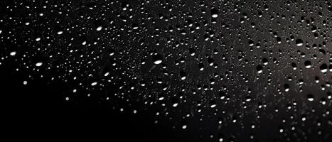 Splashes of water on a black background. photo