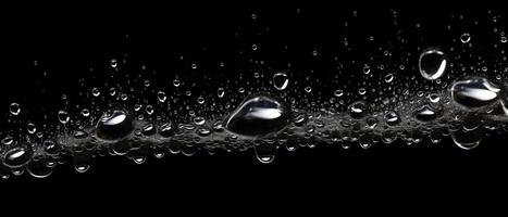 Splashes of water on a black background. photo
