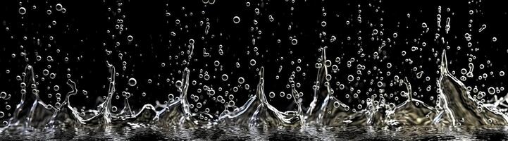 Splashes of water on a black background. photo