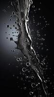 Splashes of water on a black background. photo