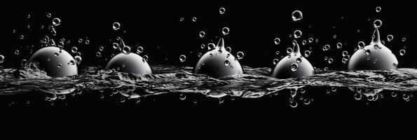 Splashes of water on a black background. photo