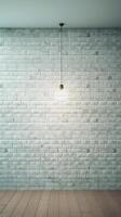 White brick wall with a lamp on the background of stone tiles. . photo