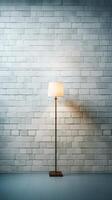 White brick wall with a lamp on the background of stone tiles. . photo
