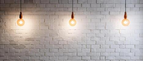 White brick wall with a lamp on the background of stone tiles. . photo