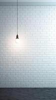 White brick wall with a lamp on the background of stone tiles. . photo