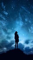 Silhouette of a girl looks at the starry sky. . photo