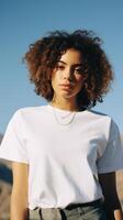 A beautiful girl in a white T-shirt against the background of a beautiful landscape. . photo