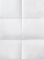 white sheet of paper folded in six With texture. photo