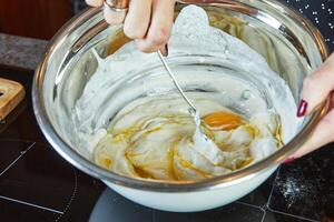 Making a pie in your home kitchen from several types of cheeses, mozzarella, tsfati and others photo