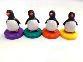 a group of penguin toys isolated on white background. copy space for text. Holiday season themes background photo