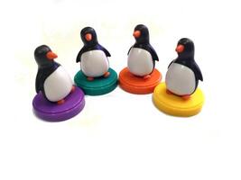 a group of penguin toys isolated on white background. copy space for text. Holiday season themes background photo