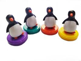 a group of penguin toys isolated on white background. copy space for text. Holiday season themes background photo