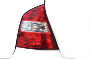 Car red tail lights isolated on white background. Transportation concept element for communication visual ads photo