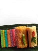 Assorted colorful Indonesian traditional cakes isolated on white background. photo
