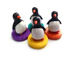 a group of penguin toys isolated on white background. copy space for text. Holiday season themes background photo