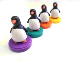 a group of penguin toys isolated on white background. copy space for text. Holiday season themes background photo