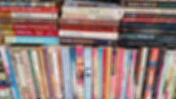 Abstract blurred public library with bookshelves interior space. Defocused effect for education concepts background. photo