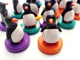 a group of penguin toys isolated on white background. copy space for text. Holiday season themes background photo